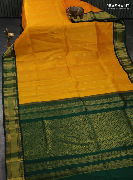 Kuppadam silk cotton saree mango yellow and bottle green with allover zari woven buttas and zari woven korvai border