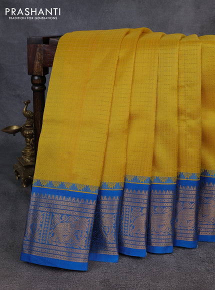 Kuppadam silk cotton saree yellow and cs blue with allover laksha deepam pattern and temple design elepant zari woven border