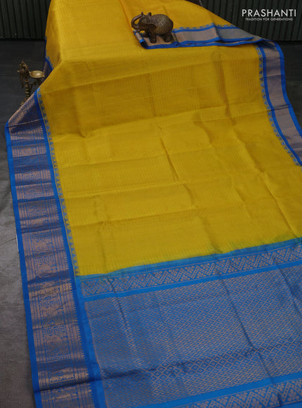 Kuppadam silk cotton saree yellow and cs blue with allover laksha deepam pattern and temple design elepant zari woven border