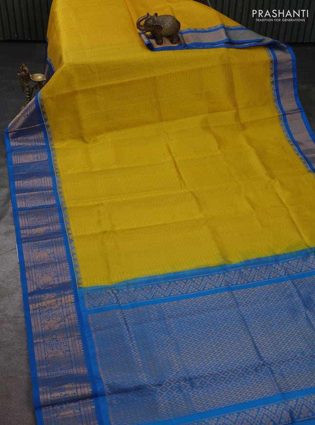 Kuppadam silk cotton saree yellow and cs blue with allover laksha deepam pattern and temple design elepant zari woven border