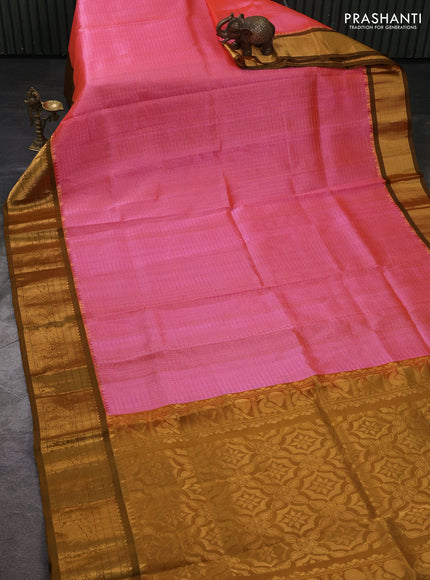 Kuppadam silk cotton saree candy pink and mustard green with allover laksha deepam pattern and temple design elepant zari woven border
