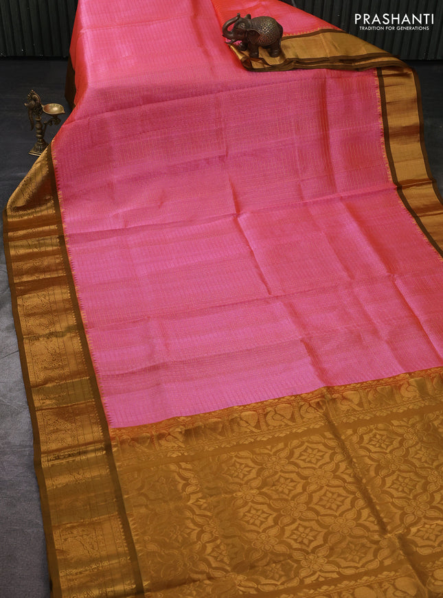 Kuppadam silk cotton saree candy pink and mustard green with allover laksha deepam pattern and temple design elepant zari woven border