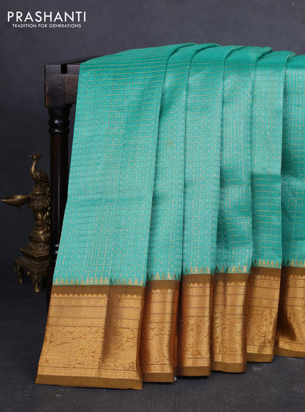 Kuppadam silk cotton saree teal green and mustard green with allover laksha deepam pattern and temple design elepant zari woven border