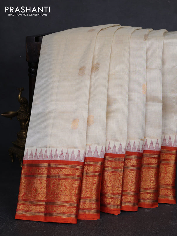 Kuppadam silk cotton saree off white and orange with allover vairaosi pattern & buttas and temple design zari woven border