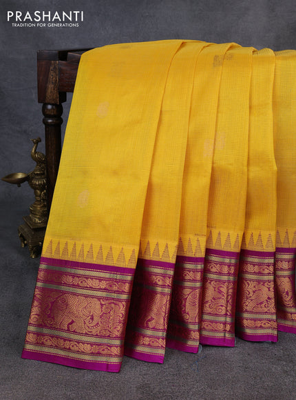 Kuppadam silk cotton saree yellow and magenta pink with allover vairaosi pattern & buttas and temple design zari woven border