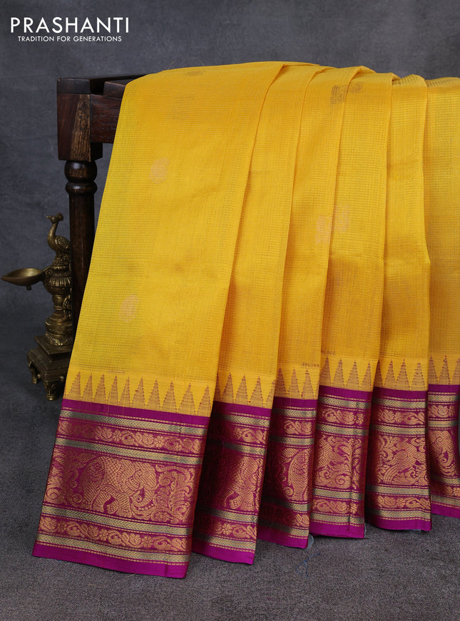 Kuppadam silk cotton saree yellow and magenta pink with allover vairaosi pattern & buttas and temple design zari woven border
