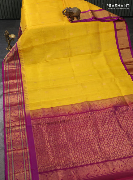 Kuppadam silk cotton saree yellow and magenta pink with allover vairaosi pattern & buttas and temple design zari woven border