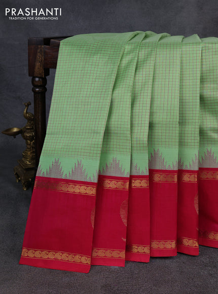 Kuppadam silk cotton saree pista green and pink with allover thread checked pattern and temple design rettapet zari woven butta border