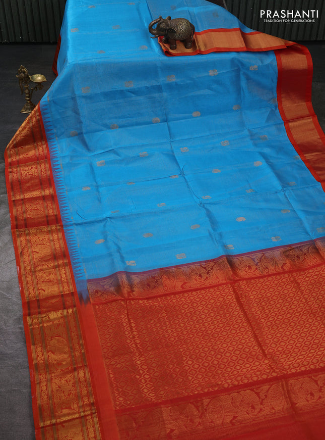 Kuppadam silk cotton saree cs blue and orange with allover vaiarosi pattern & buttas and temple design zari woven border
