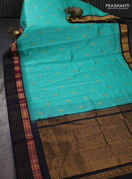Kuppadam silk cotton saree teal green and black with zari woven buttas and temple design zari woven butta border