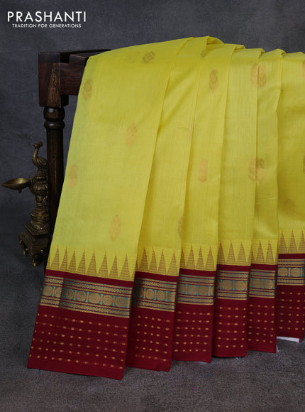 Kuppadam silk cotton saree lime yellow and maroon with zari woven buttas and temple design zari woven butta border