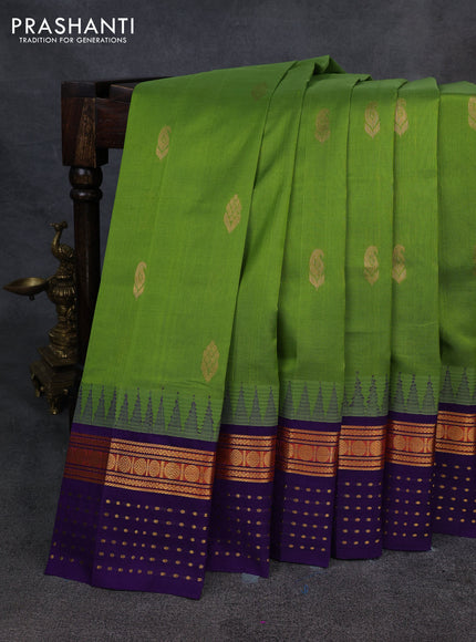 Kuppadam silk cotton saree light green and violet with zari woven buttas and temple design zari woven butta border