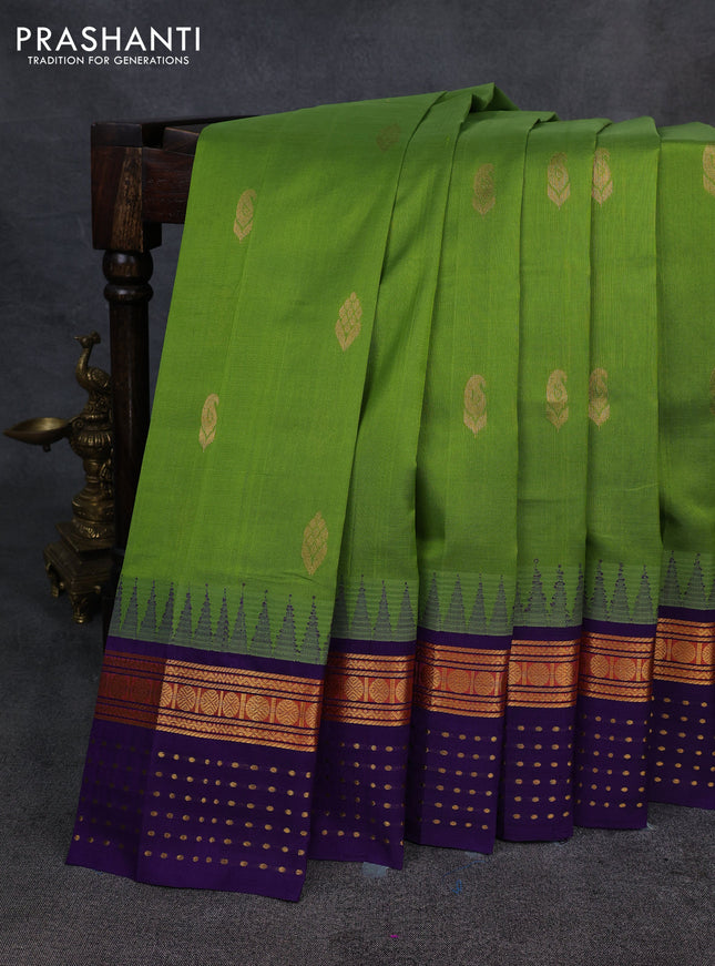 Kuppadam silk cotton saree light green and violet with zari woven buttas and temple design zari woven butta border