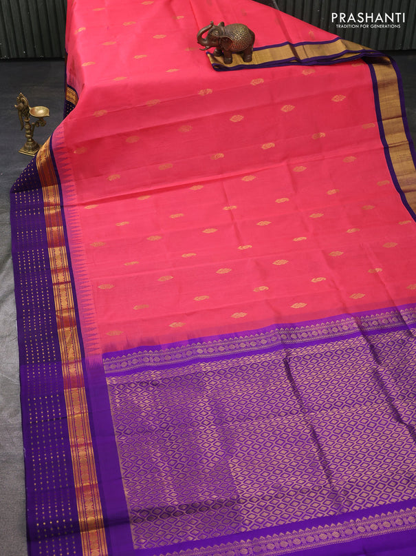 Kuppadam silk cotton saree peach pink and violet with zari woven buttas and temple design zari woven butta border