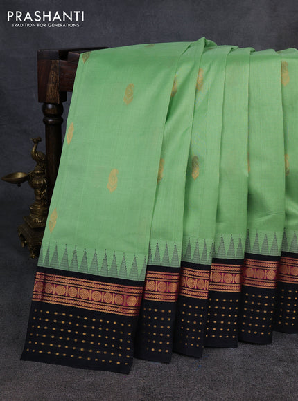 Kuppadam silk cotton saree pista green and black with zari woven buttas and temple design zari woven butta border
