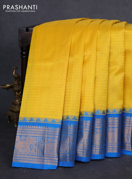 Kuppadam silk cotton saree yellow and cs blue with allover laksha deepam pattern and temple design zari woven border