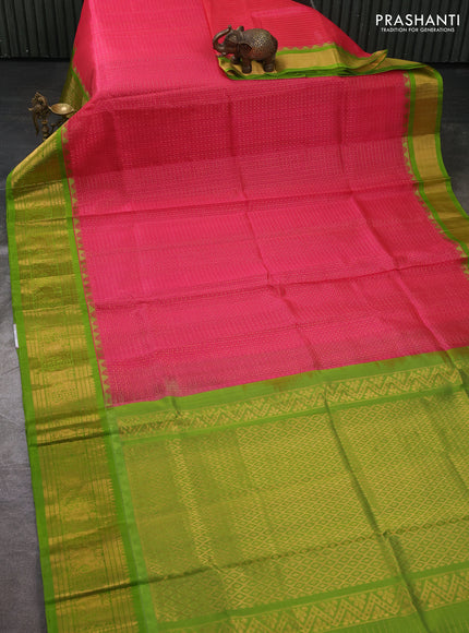 Kuppadam silk cotton saree candy pink and light green with allover laksha deepam pattern and temple design zari woven border