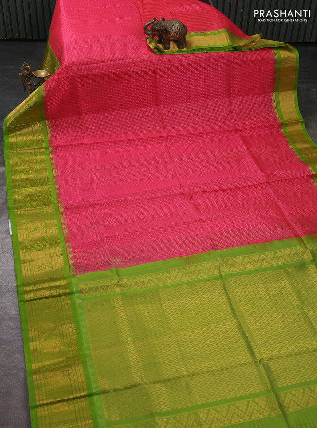 Kuppadam silk cotton saree candy pink and light green with allover laksha deepam pattern and temple design zari woven border