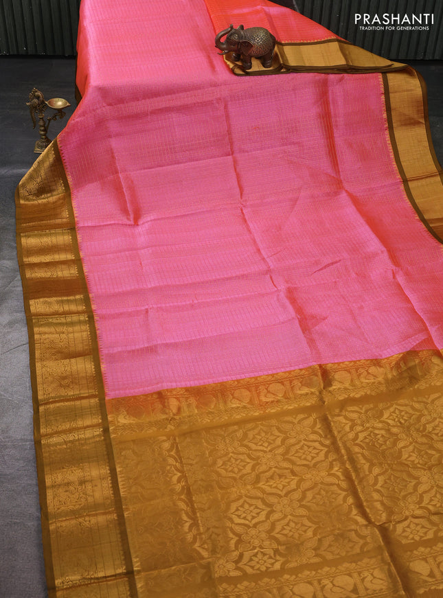 Kuppadam silk cotton saree candy pink and mustard green with allover laksha deepam pattern and temple design zari woven border