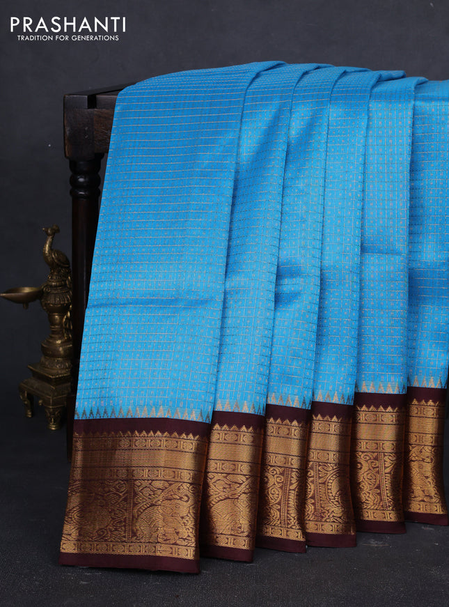 Kuppadam silk cotton saree cs blue and coffee brown with allover laksha deepam pattern and temple design zari woven border