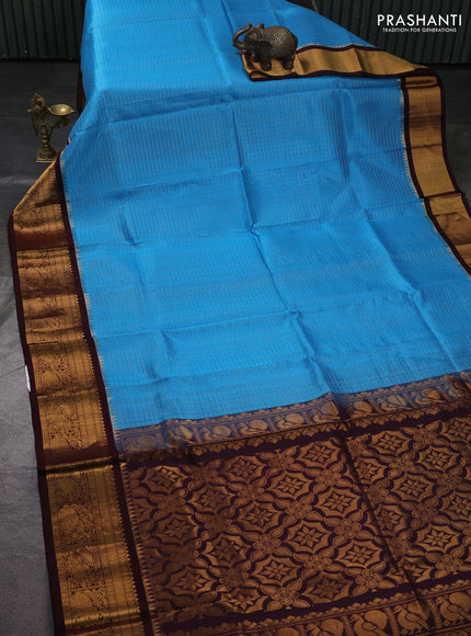 Kuppadam silk cotton saree cs blue and coffee brown with allover laksha deepam pattern and temple design zari woven border