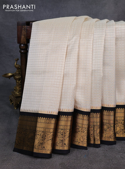 Kuppadam silk cotton saree cream and black with allover laksha deepam pattern and temple design zari woven border