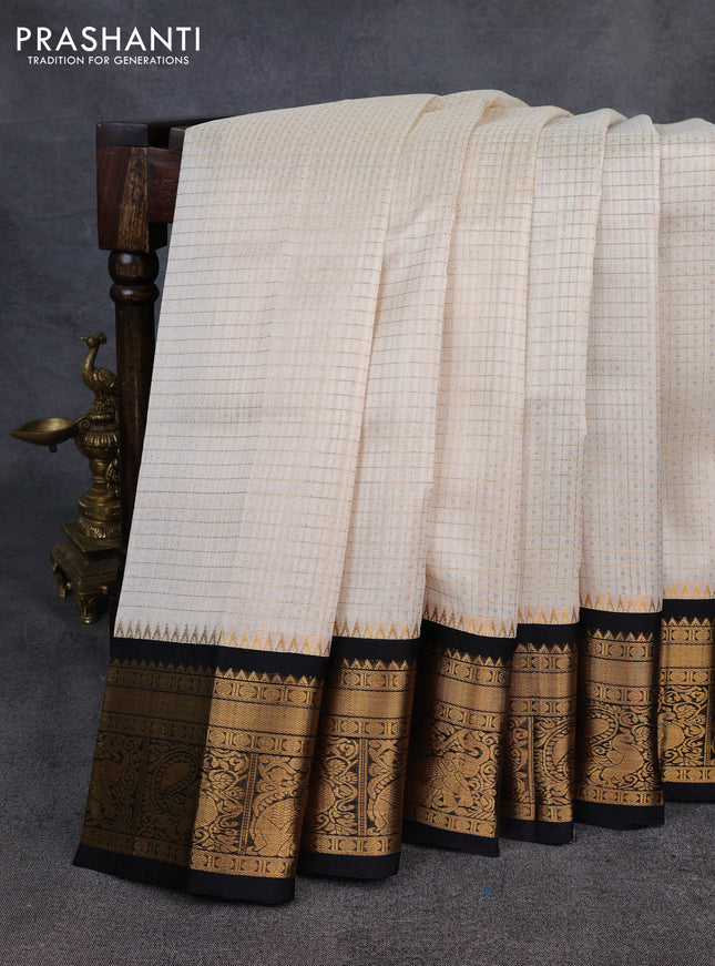 Kuppadam silk cotton saree cream and black with allover laksha deepam pattern and temple design zari woven border