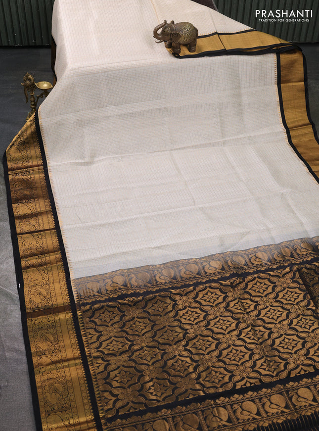 Kuppadam silk cotton saree cream and black with allover laksha deepam pattern and temple design zari woven border