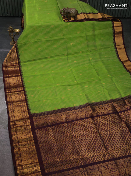 Kuppadam silk cotton saree with allover zari checked pattern and temple design zari woven border