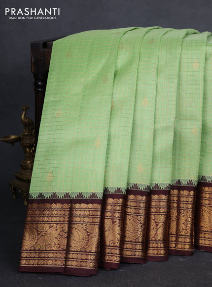 Kuppadam silk cotton saree pista green and coffee brown with allover zari checked pattern and temple design zari woven border