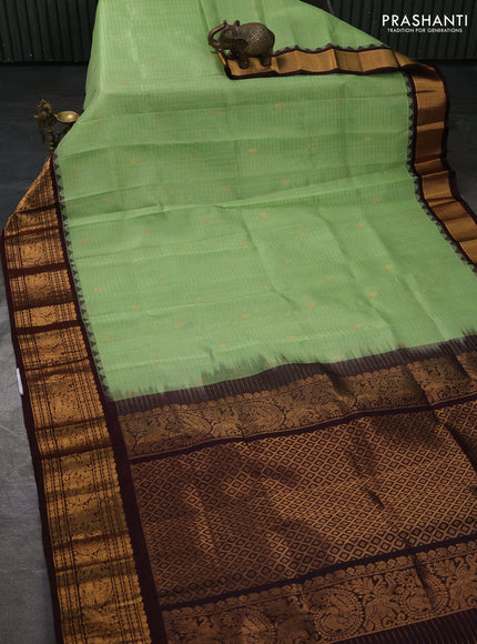 Kuppadam silk cotton saree pista green and coffee brown with allover zari checked pattern and temple design zari woven border