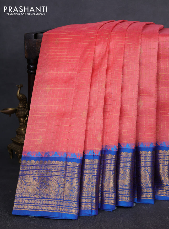 Kuppadam silk cotton saree peach orange and cs blue with allover zari checked pattern and temple design zari woven border