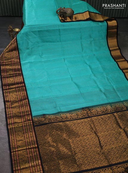 Kuppadam silk cotton saree teal green and black with allover zari checked pattern and long zari woven korvai border