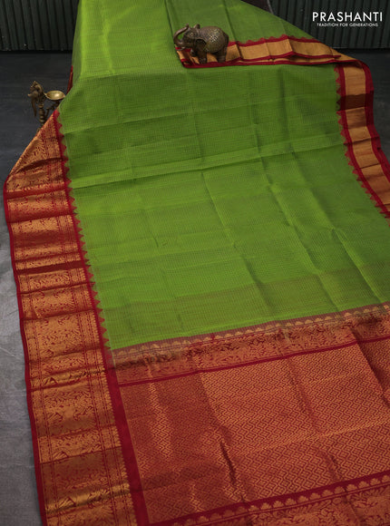 Kuppadam silk cotton saree light green and maroon with allover thread checked pattern and temple design long zari woven border