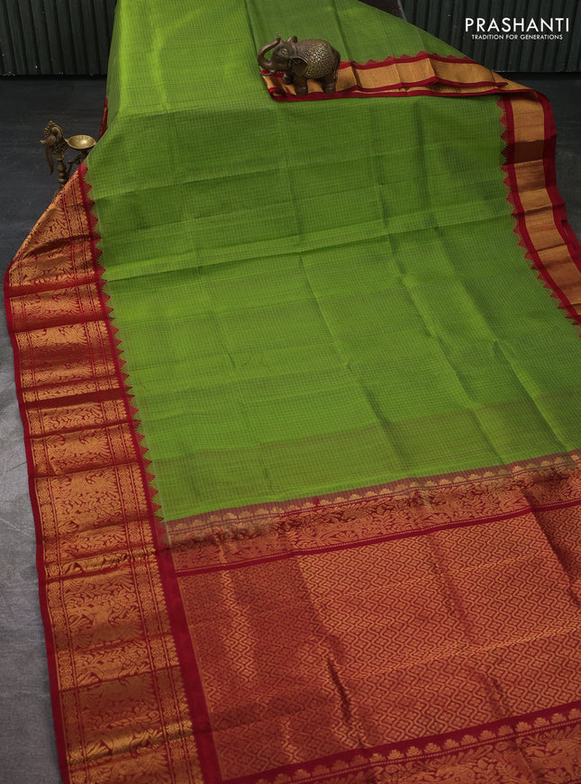 Kuppadam silk cotton saree light green and maroon with allover thread checked pattern and temple design long zari woven border