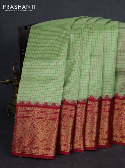 Kuppadam silk cotton saree pista green and maroon with allover thread checked pattern and temple design long zari woven border