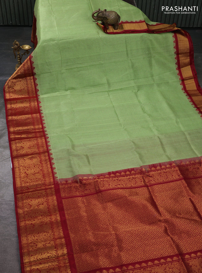 Kuppadam silk cotton saree pista green and maroon with allover thread checked pattern and temple design long zari woven border