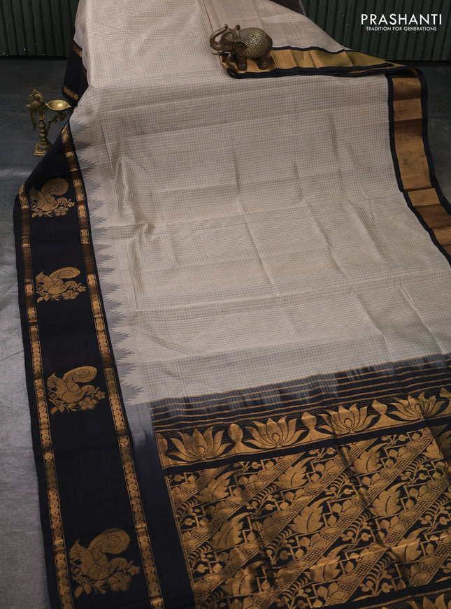 Kuppadam silk cotton saree beige and black with allover thread checked pattern and temple design rettapet zari woven butta border