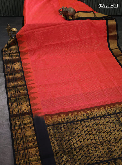 Kuppadam silk cotton saree orange and black with allover laksha deepam pattern and temple design zari woven border
