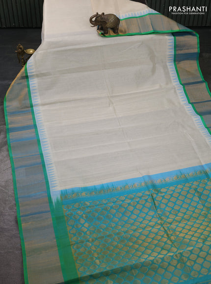 Kuppadam silk cotton saree off white and light green with plain body and temple design zari woven border
