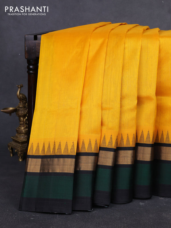 Kuppadam silk cotton saree yellow and bottle green black with plain body and temple design zari woven simple border