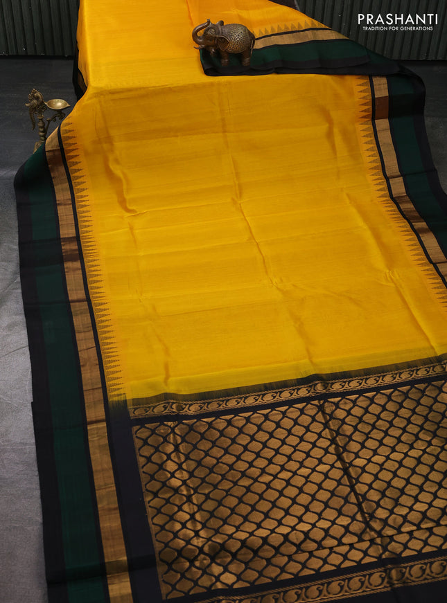 Kuppadam silk cotton saree yellow and bottle green black with plain body and temple design zari woven simple border
