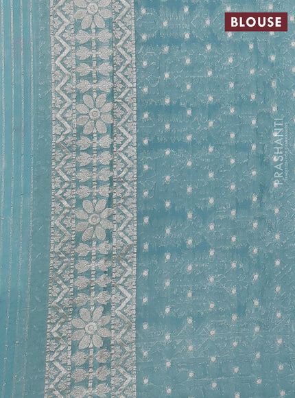 Art chiffon saree pastel blue with allover thread & zari floral weaves and zari woven border