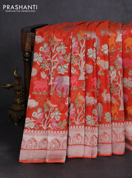 Art chiffon saree orange with allover vanasingaram weaves and zari woven border