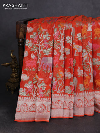 Art chiffon saree orange with allover vanasingaram weaves and zari woven border