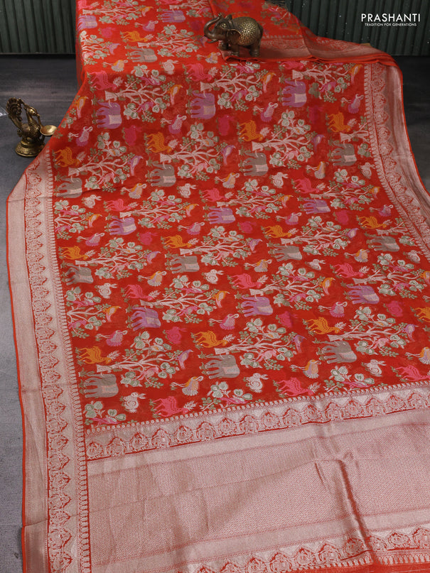 Art chiffon saree orange with allover vanasingaram weaves and zari woven border