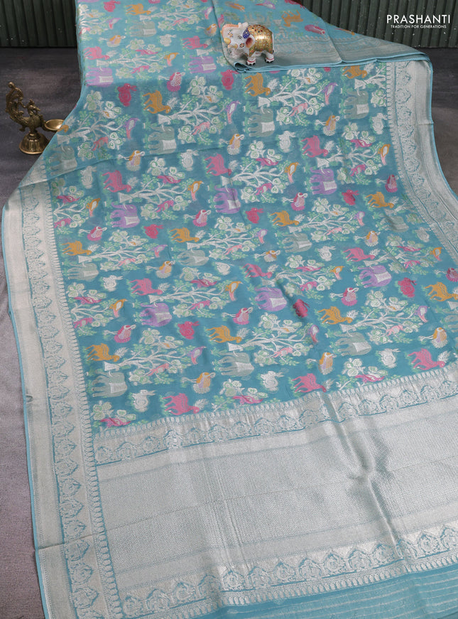 Art chiffon saree pastel blue with allover vanasingaram weaves and zari woven border
