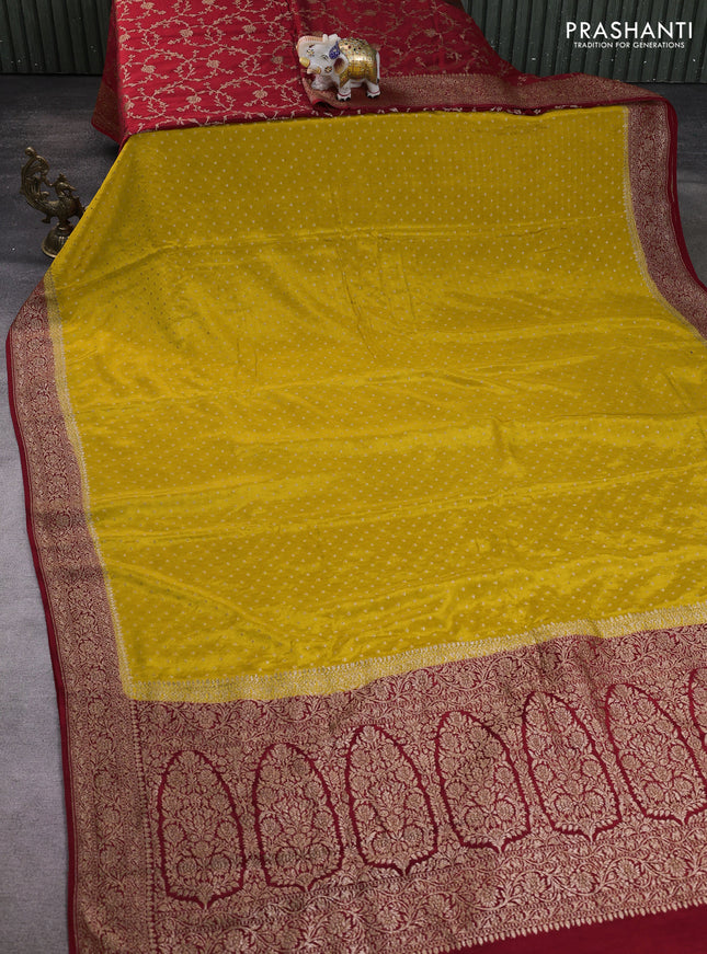 Banarasi crepe partly saree mustard yellow and red with allover thread & zari woven buttas and woven border