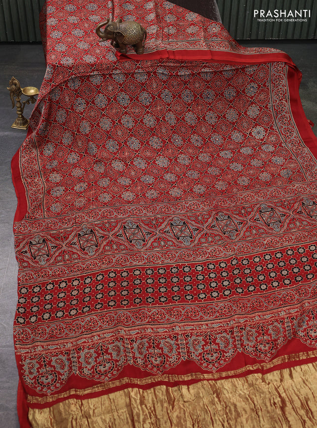 Modal silk saree maroon with allover ajrakh prints and printed border