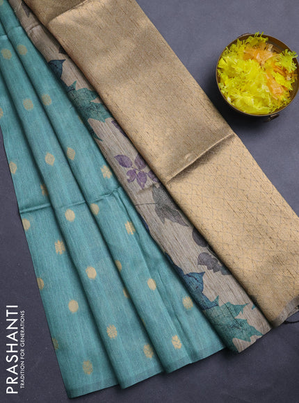 Art dupion saree pastel green and beige with allover zari woven buttas and printed pallu